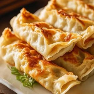 锅贴起源于哪个地方_酥香美味，南北风味各异
