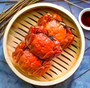螃蟹蒸熟后脚肉怎么黑啊_蒸熟螃蟹脚肉变黑正常，变质异味不可食